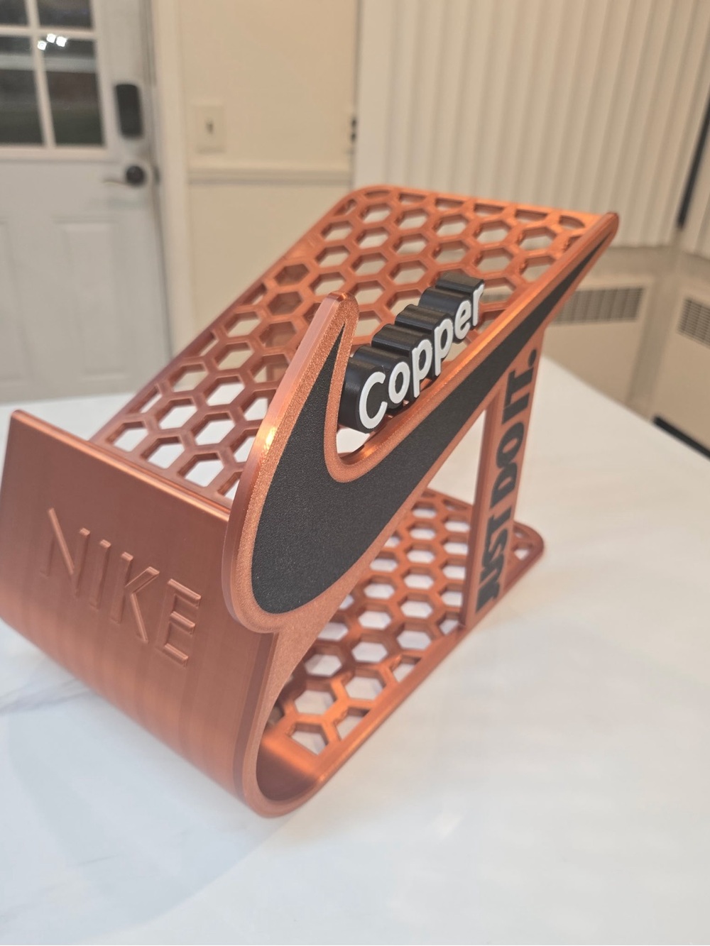 Nike Metallic Copper shoe Stand with Contrast Black Swoosh